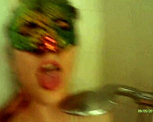 A husband and wife share a sensual early morning shower routine.