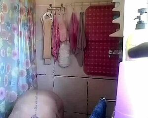 Caught my friend's hot milf on spycam fingering her wet shaved pussy