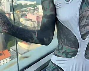 bikini model with feettattoo lounges by pattaya rooftop pool