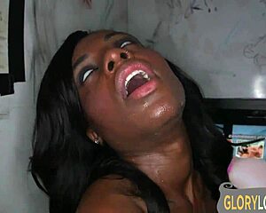 Hot ebony babe swallows deep in gloryhole action