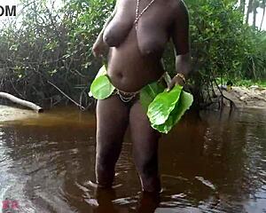 busty african grinds huge ass and tits in outdoor ritual dance