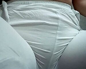 She squats low over the floor letting her pussy release a stream