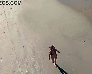 Wanna join that beach walk with her big tits bouncing?