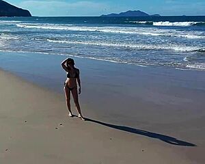 Wanna join that beach walk with her big tits bouncing?