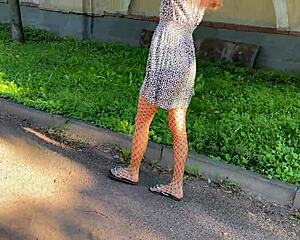 skinny teen lifts skirt flashing small tits ass plug through fishnet pantyhose outdoors