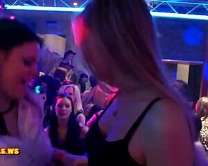 Lesbians sharing steamy kisses at nightclub party