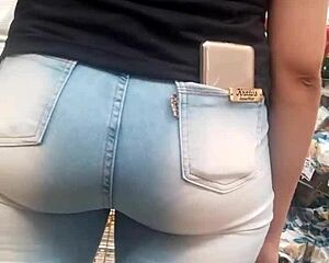 Hot brunette ass in jeans spied on at market shop