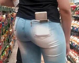 Hot brunette ass in jeans spied on at market shop