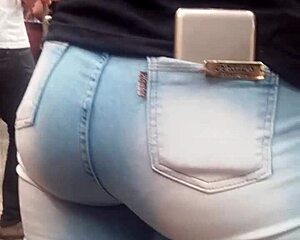 Hot brunette ass in jeans spied on at market shop