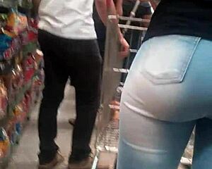 Hot brunette ass in jeans spied on at market shop
