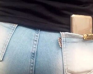 Hot brunette ass in jeans spied on at market shop