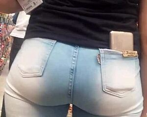 Hot brunette ass in jeans spied on at market shop