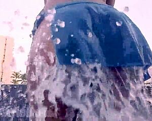 Hairy Latina babe flashes wet pussy under miniskirt outdoors