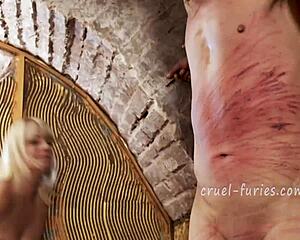 cruel blonde milf mistress brutally whips helpless guys throbbing cock