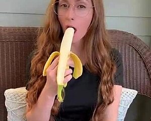 Redhead Long Hair Devours Banana Hungrily