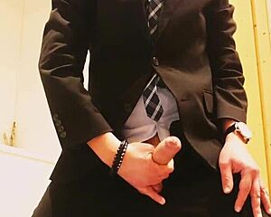 guy strokes off in tight business suit on webcam