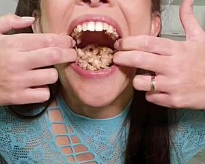 Brunette with pigtails and natural tits eats junk food then spits it out in fetish play