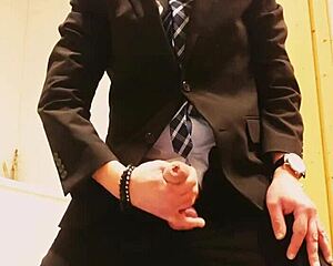 guy strokes off in tight business suit on webcam