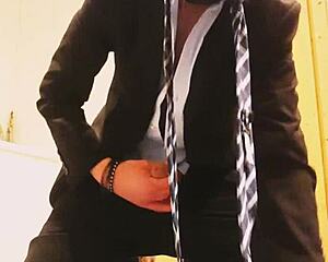 guy strokes off in tight business suit on webcam