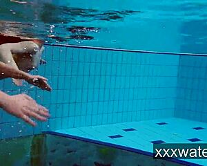 Milana and Katrin rip bikinis stripping nude underwater at beach pool