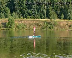 skinny slut flashes small tits in pink micro bikini outdoors