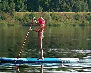 skinny slut flashes small tits in pink micro bikini outdoors