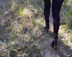 hey check out this sexy amateur in high heels and pantyhose strutting through the forest...