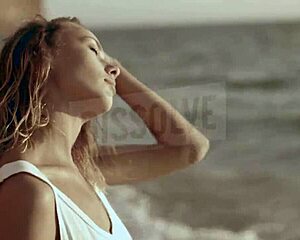 blonde russian on beach with wet see-through bra nipples showing salt skin