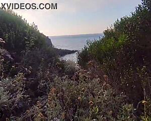 skinny slut gives deep blowjob on seaside rocks, tits out