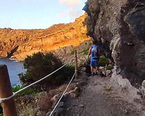 skinny slut gives deep blowjob on seaside rocks, tits out