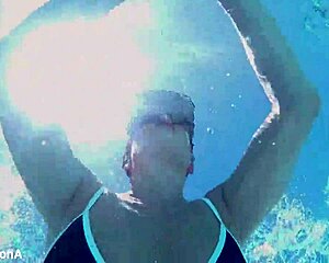 Lesbian strap-on fucks underwater with ass licking