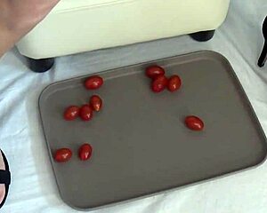 Housewife milf crushes ripe tomatoes under bare feet
