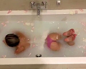 Watch her relax in a flower-filled bath, teasing playfully with gentle touches