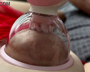 crazy vacuum tongue laps her big natural tits nipples sweetly in bed