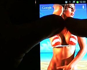 A lively interactive wallpaper features beach bikini boobs bouncing on your mobile.