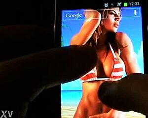 A lively interactive wallpaper features beach bikini boobs bouncing on your mobile.