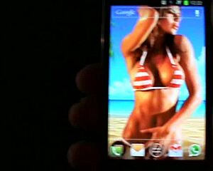 A lively interactive wallpaper features beach bikini boobs bouncing on your mobile.