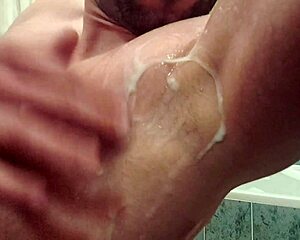 muscular bodybuilder spits in armpit during solo gay fetish play
