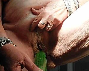 grandma stuffs cucumber deep in hairy granny pussy??