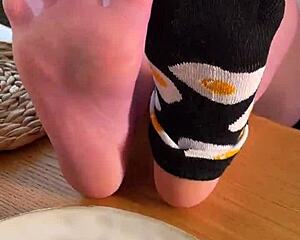 She teases with fragrant nylon feet on desk inviting you to savor every toe