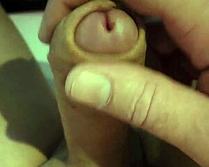 Close-up handjob strokes massive cock nude in public parking lot car masturbation