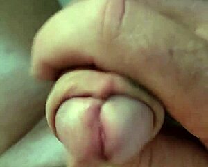 Close-up handjob strokes massive cock nude in public parking lot car masturbation