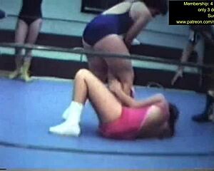 mixed wrestling match unfolds with intense grapples and holds