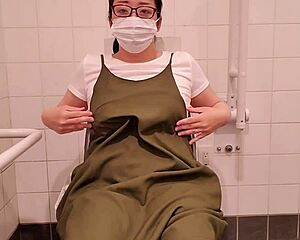 Watch this desperate Japanese housewife finger herself to orgasm in the filthy toilet stall!
