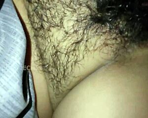 She sleeps as I slide into her hairy pussy without waking till I cum all over her ass