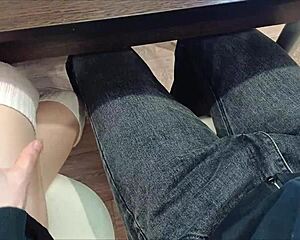 Jerked off classmate's cock under desk during lecture in miniskirt heels socks