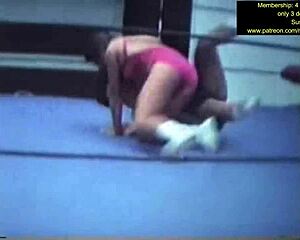 mixed wrestling match unfolds with intense grapples and holds