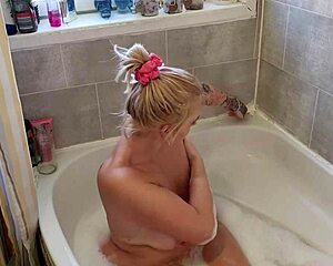 milf relaxes in the bath with her toys on a horny afternoon
