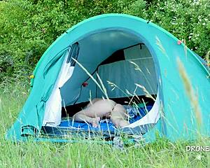 nudist milf sits in the tent