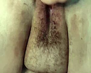 a bbw milf with fat hairy beaver gets fisted in close up view